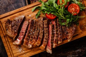 Wholesale beef sliced into pieces on a slab